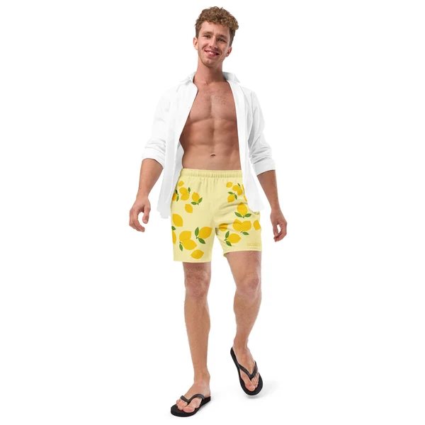 Lemon Drop swim trunks styled with an open white shirt